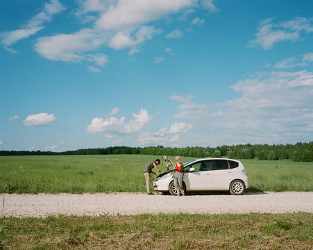 Couple after a car breakdown at the side of the road