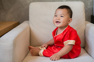 Asian baby wearing Chinese clothing