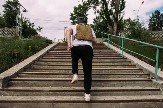 powerful street work-out of the crossfit athlete - running in the asphalt playground