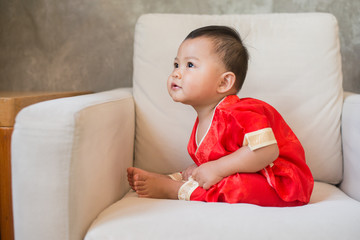 Asian baby wearing Chinese clothing