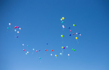 balloons in the sky. balloons in the blue sky. balls in honor of the last call. last call. graduation.