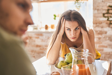 Attentive brunette girl looking at her boyfriend