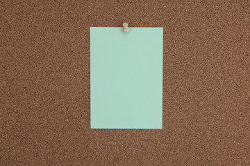 Cork board with tacks and green flash card