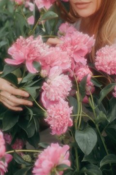 Anonymous woman holding flowers