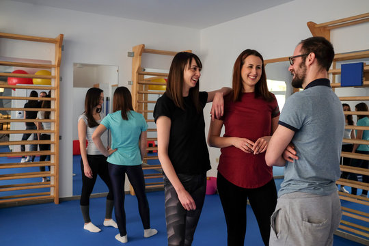 Group of young people chating after workout