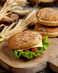 delicious sandwich with lettuce cheese tomato and bread with seeds