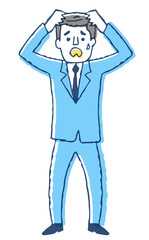 困って頭を抱えるビジネスマン