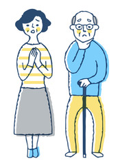 困っている表情のシニア夫婦
