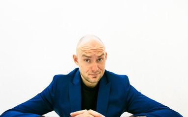 Close up of person face looking surprised and skeptical.Funny background image of business people.