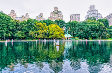 Conservatory Water pond with remote controlled sailing model boats during the gloomy weather in the Central Park, New York.