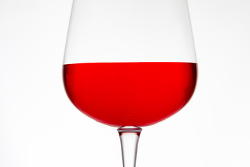 Glass of red wine in the foreground