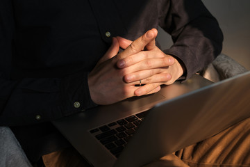 Businessman with a laptop. Freelancer making job from home, online remote work. Men hands on the...