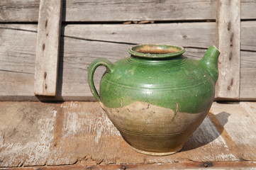 old clay jug kettle, a vessel with a neck and ceramic handle