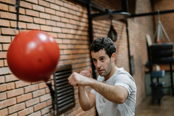 Brunette Man Boxing Indoors.