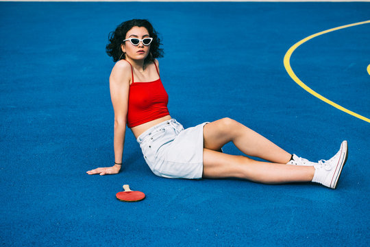 Cool Sporty Female Teenager on Blue Background
