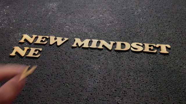 New mindset new results wooden words letter, motivational self development business typography quotes concept on black background