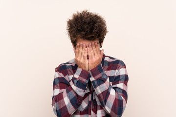 Young caucasian man with tired and sick expression