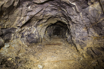 Underground abandoned platinum ore mine tunnel