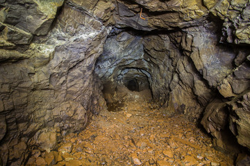 Underground abandoned platinum ore mine tunnel