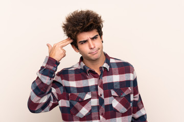 Young caucasian man with problems making suicide gesture
