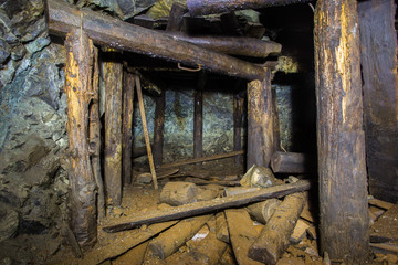 Underground abandoned platinum ore mine tunnel collapsed wooden timbering