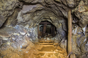 Underground abandoned platinum ore mine tunnel collapsed wooden timbering