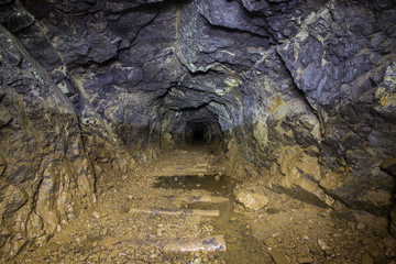Underground abandoned platinum ore mine tunnel