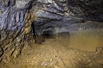 Underground abandoned platinum ore mine tunnel