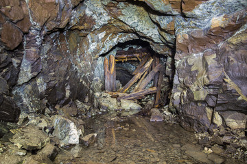 Underground abandoned platinum ore mine tunnel collapsed wooden timbering