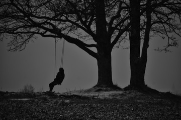 lonely tree in the snow with human