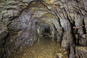 Underground abandoned platinum ore mine tunnel with water