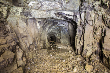 Underground abandoned platinum ore mine tunnel