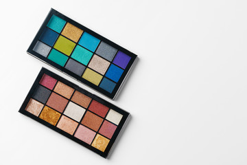 Make up colorful eyeshadow palettes isolated on white, top view
