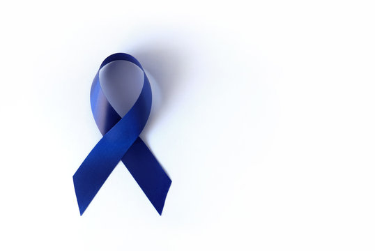 Blue ribbon on a white background is a symbol of the problem of Stevens-Jones syndrome, colon cancer, problem of hydranencephaly, chronic fatigue syndrome, myalgic encephalomyelitis. Week no smoking
