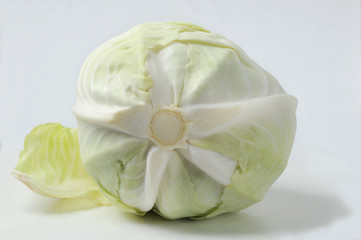 Fototapeta na wymiar cabbage on a white background - cabbage head and cabbage leaf