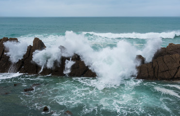 Waves crushing on the oceans rocks