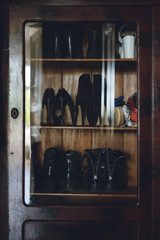 Fototapeta na wymiar shoes in antique wardrobe