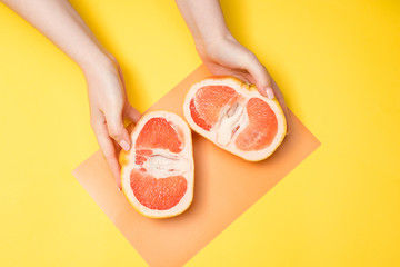 grapefruit and hands