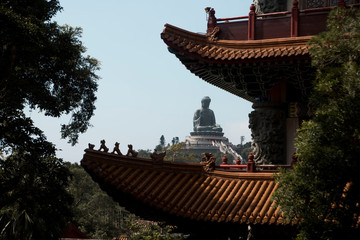 giant buddha statue through pagoda architecture