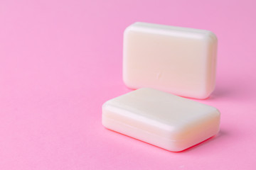 Soap bar isolated on pink background.