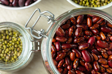 Raw cereals or beans in glass jars close up. Vegan and vegetarian food. Close up.