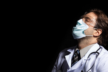 male doctor wearing a mask and goggles