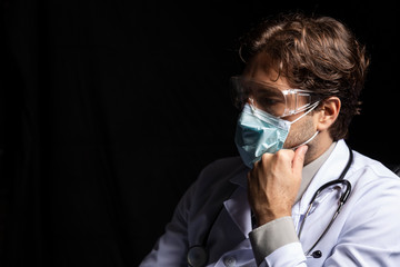 male doctor wearing a mask and goggles