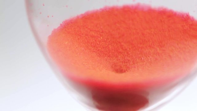 hourglass to measure time with red sand