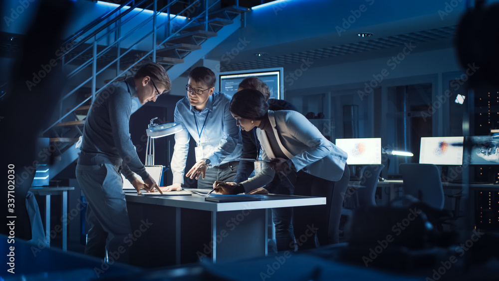 Aufkleber Diverse Team of Electronics Development Engineers Standing at the Desk Working with Documents, Solving Project Problems Late at Night. Specialists Working on Ultra Modern Industrial Design.