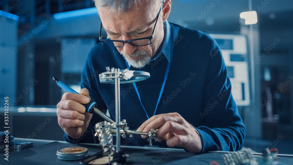 Poster electronics maintenance engineer soldering motherboard, microchip and circuit board, looking through
