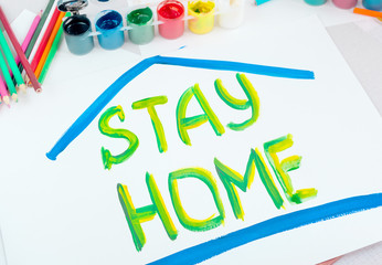 Stay at home. Children's drawing with gouache paints on a white sheet.Campaign on social networks for the prevention of coronavirus