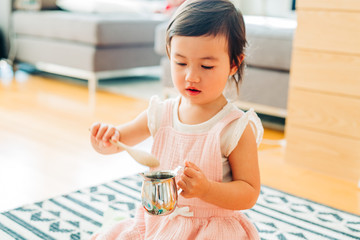 Toddler Girl Dry Bean Scooping Lesson