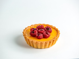 mini tart with glaze garnished with raspberries