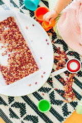 Toddler Girl Dry Bean Scooping Lesson